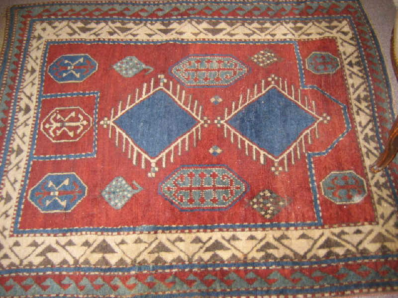 Appraisal: EARLY TH CENTURY KAZAK PRAYER RUG The wine red directional