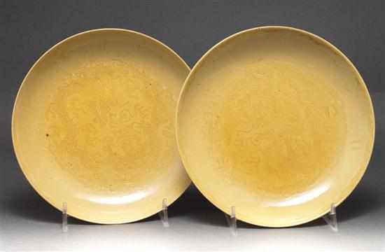 Appraisal: Pair of Chinese yellow glaze incised decorated porcelain dishes late