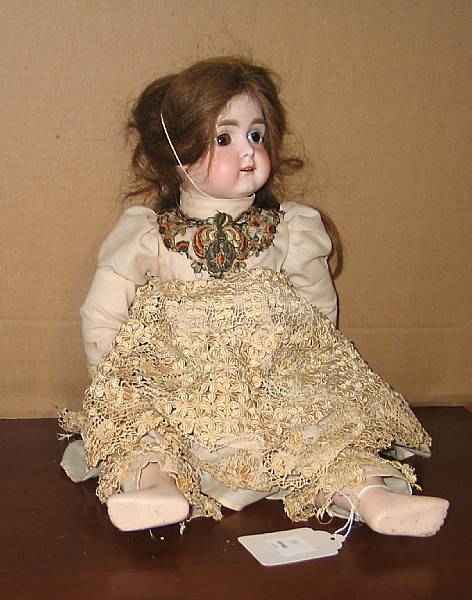 Appraisal: A German bisque-head doll Unmarked with cork pate brown wig