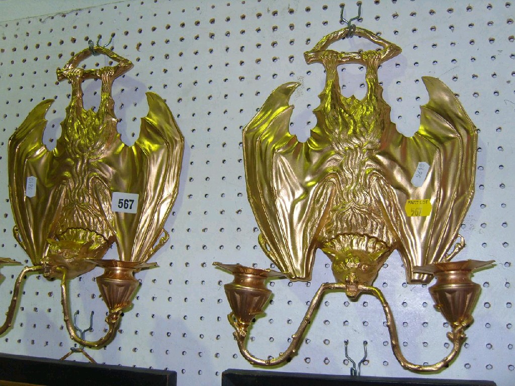 Appraisal: A pair of unusual cast metal -branch wall sconces with