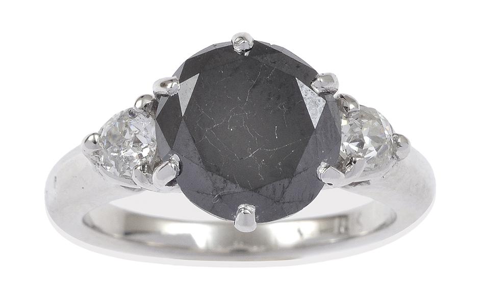 Appraisal: A BLACK DIAMOND RING The round brilliant cut black diamond