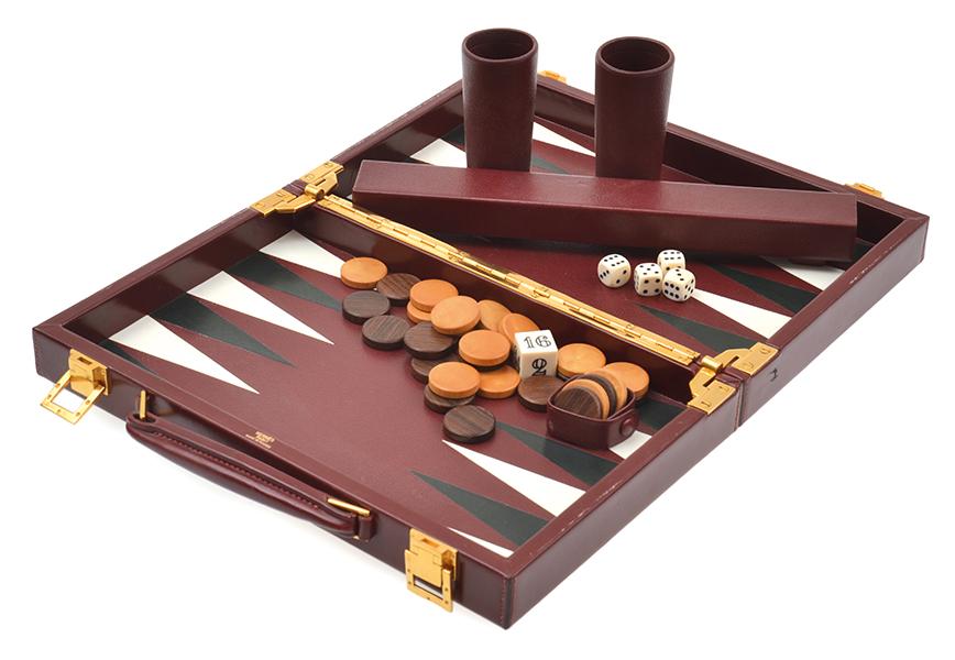 Appraisal: A HERMES LEATHER BOUND TRAVELLING BACKGAMMON SET includes two sets