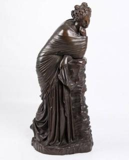 Appraisal: FRENCH BRONZE SCULPTURE OF WOMAN RESTING ON WALL FRENCH BRONZE