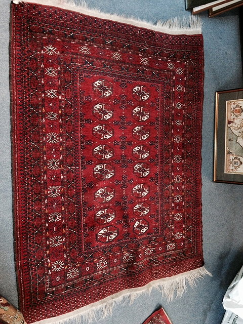 Appraisal: AN OLD AFGHAN BOKHARA RUG with geometric decoration on a