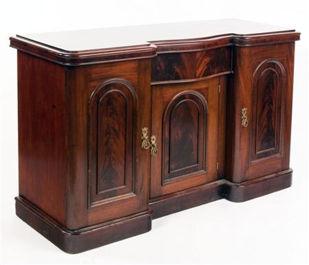 Appraisal: A Victorian mahogany inverted breakfront sideboard the moulded top over