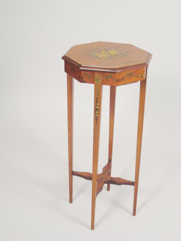 Appraisal: A satinwood octagonal Table painted instruments in