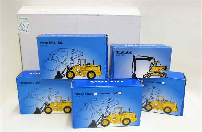 Appraisal: FIVE DIECAST SCALE MODELS OF VOLVO CONSTRUCTION EQUIPMENT PLUS TABLE