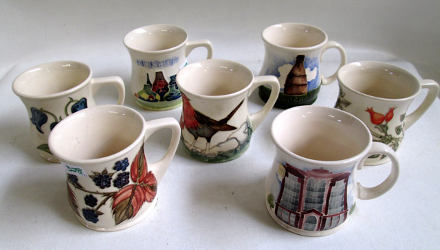 Appraisal: SEVEN MOORCROFT POTTERY COFFEE CUPS hand painted under glaze in