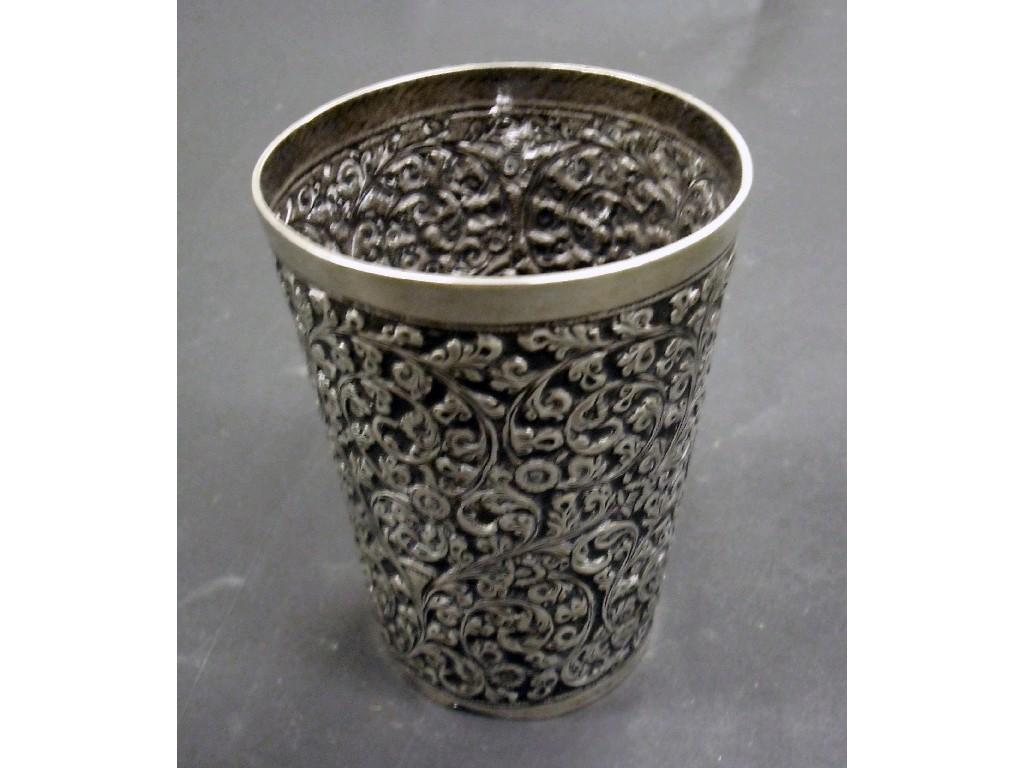 Appraisal: Eastern white metal beaker with elaborate embossed scrolling foliate decoration