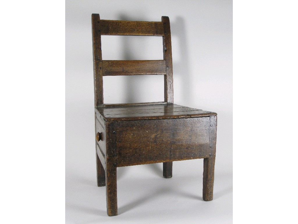 Appraisal: An early th Century Welsh oak Nursing Chair with solid