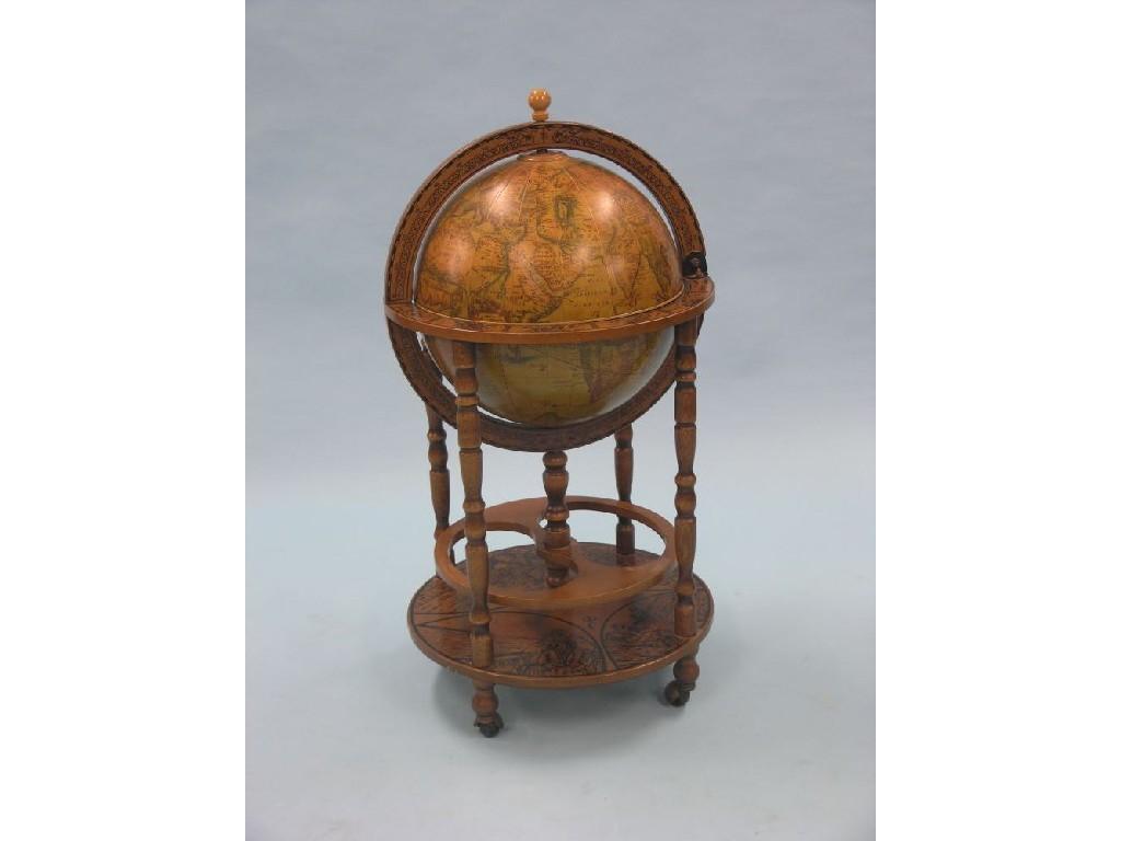 Appraisal: A drinks cabinet in the form of a globe hinged