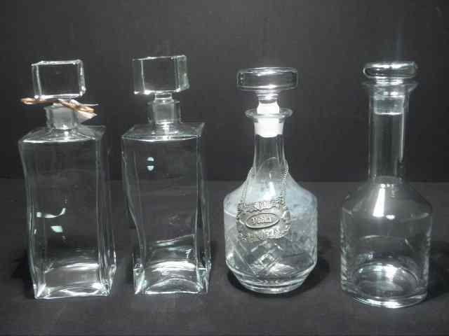 Appraisal: Lot of four assorted crystal and glass decanters Includes a