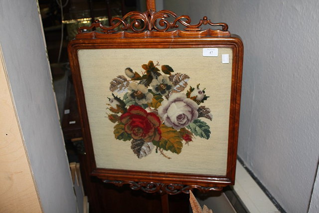 Appraisal: A VICTORIAN WALNUT POLE SCREEN with woolwork and felt inset