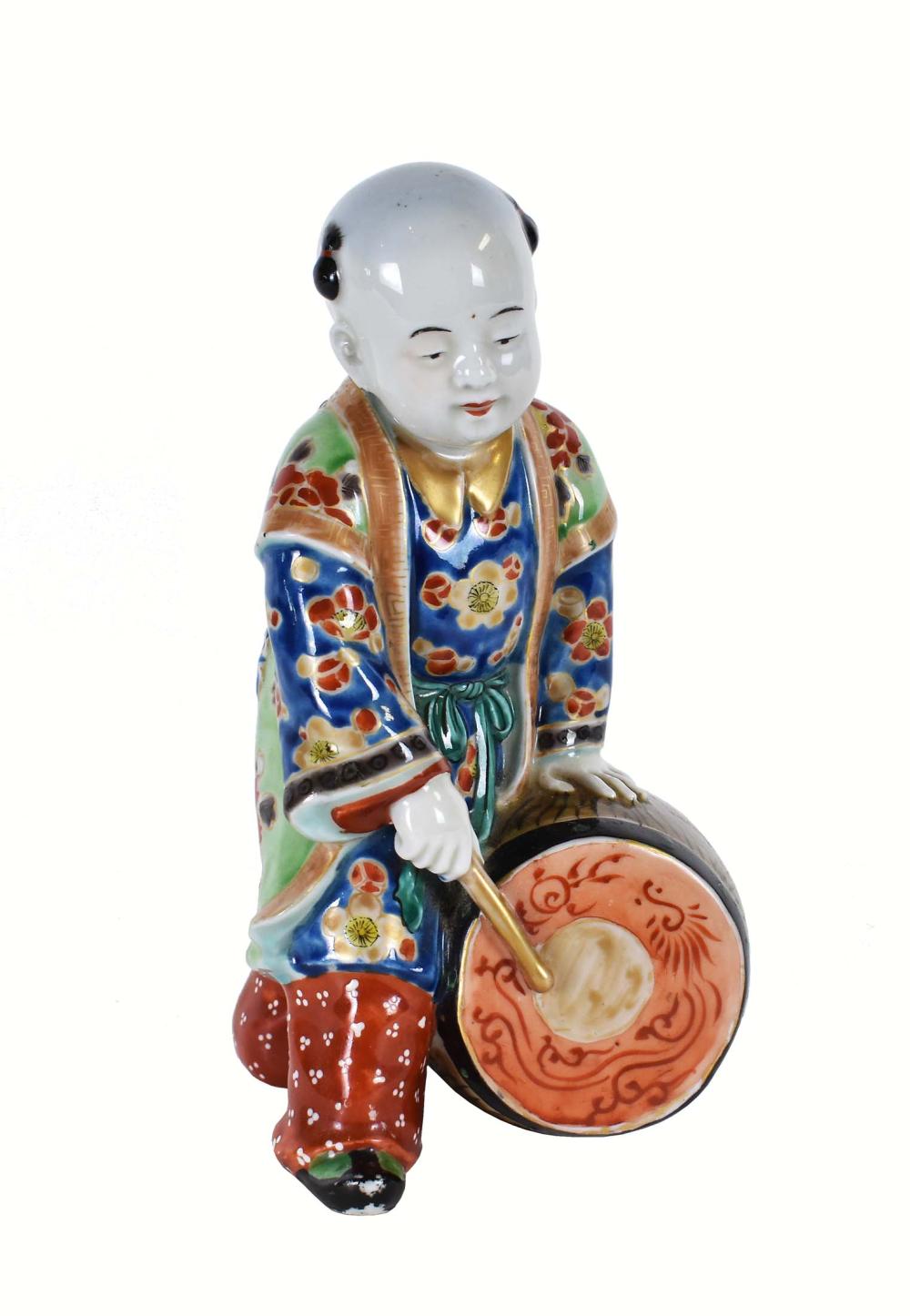 Appraisal: JAPANESE PORCELAIN FIGURE OF A BOY DRUMMER th th Century