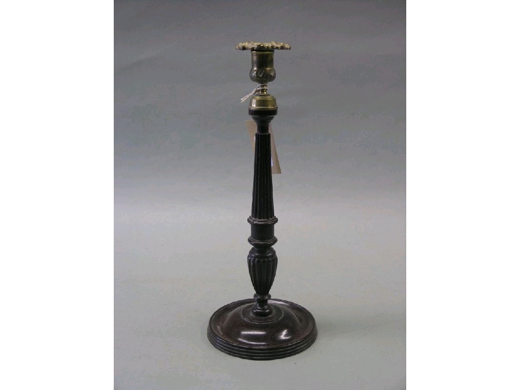 Appraisal: A Victorian mahogany candlestick cast brass sconce upon architectural reeded