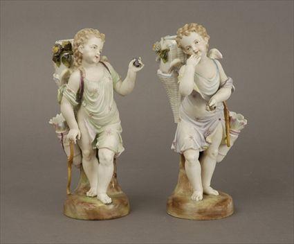 Appraisal: Pair of German Polychrome Biscuit Porcelain Eros Figure Vases Each