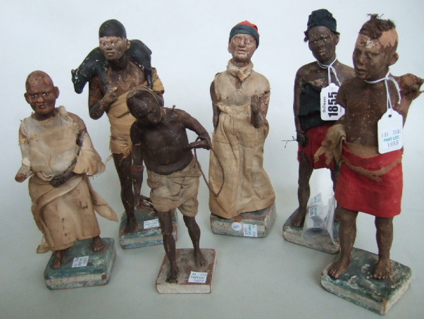 Appraisal: Six terracotta ethnic figures th century modelled as painted African