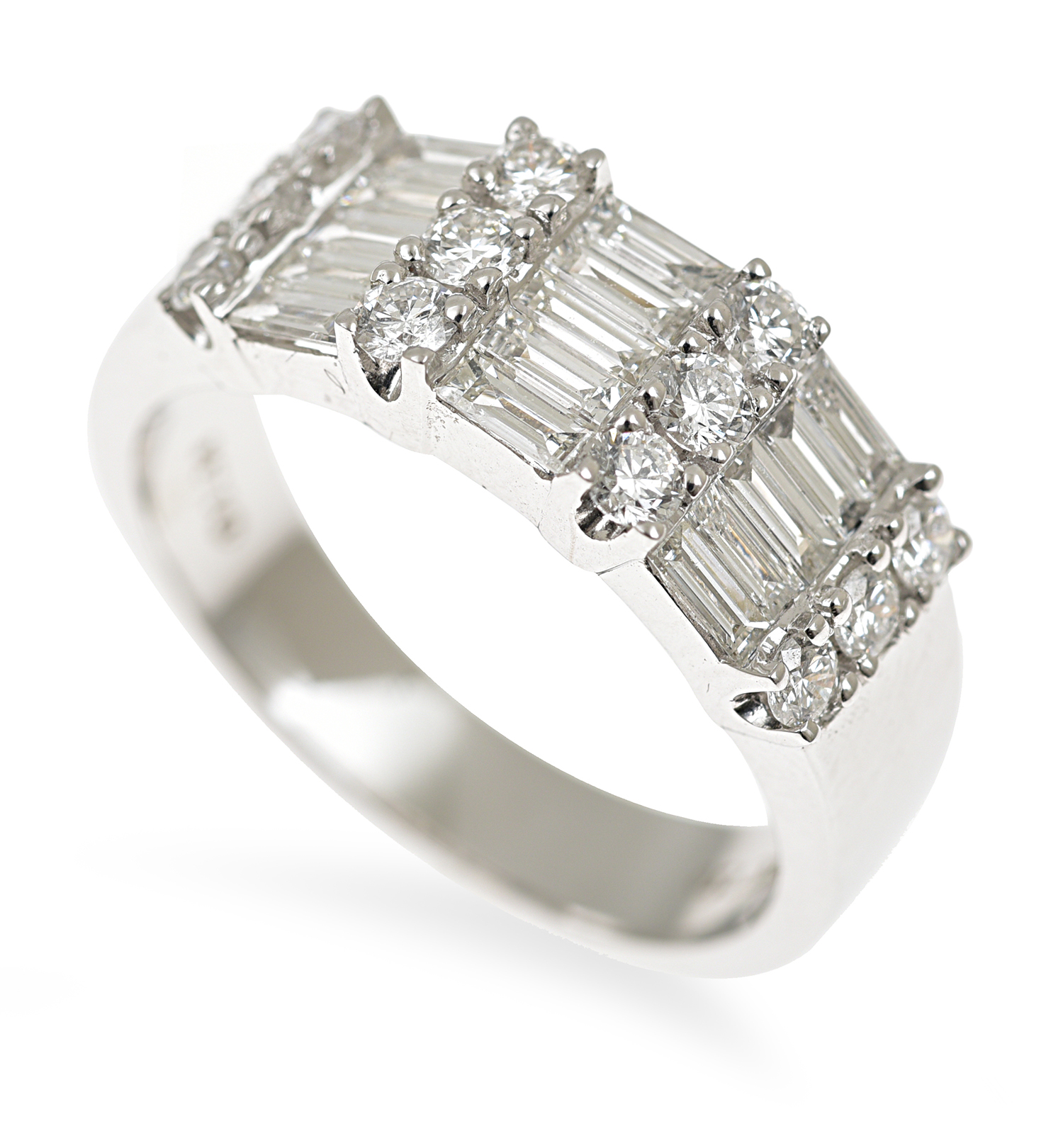 Appraisal: A DIAMOND DRESS RING Comprising baguette and round brilliant cut