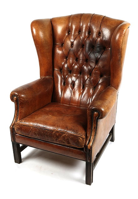 Appraisal: A PAIR OF GEORGIAN STYLE BROWN LEATHER LIBRARY WING ARMCHAIRS