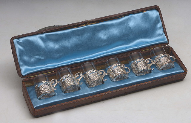 Appraisal: A SET OF SIX SILVER MOUNTED LIQUER GLASSES with embossed