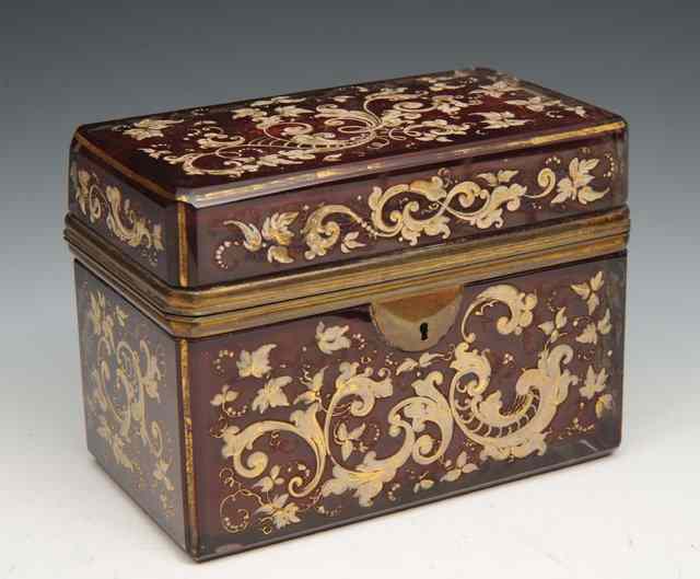 Appraisal: A CONTINENTAL RUBY FLASH GLASS CASKET the scrolling floral decoration