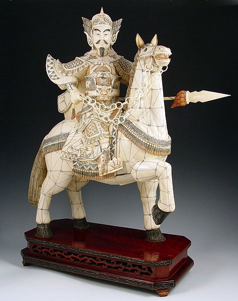 Appraisal: CHINESE CARVED AND CLAD BONE WARRIOR ON HORSE Note damage