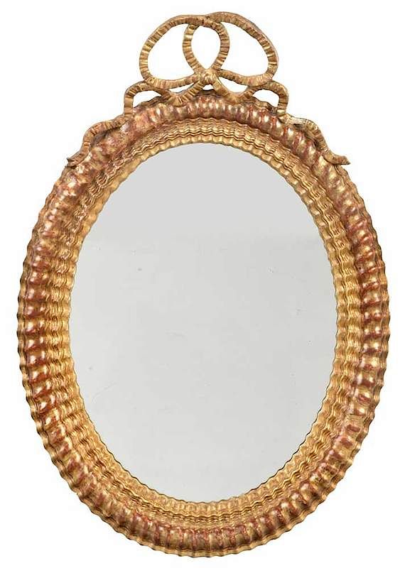 Appraisal: Louis XVI Style Carved and Gilt Oval Mirror French late