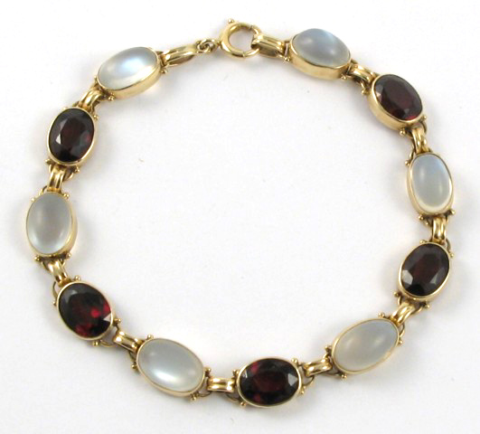 Appraisal: GARNET MOONSTONE AND YELLOW GOLD BRACELET The k yellow gold