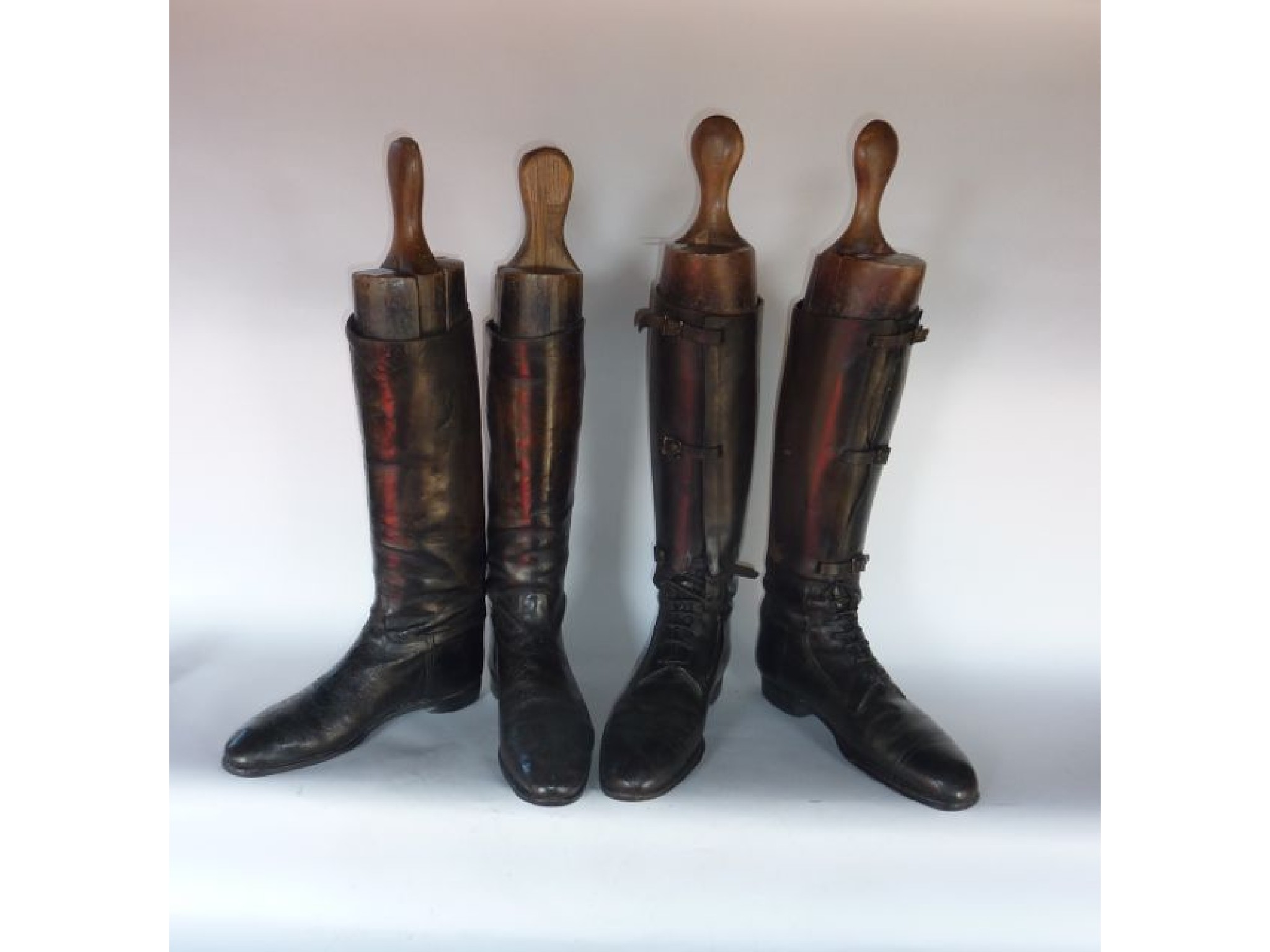 Appraisal: A pair of antique English laced black leather riding boots