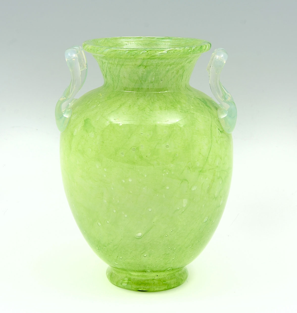 Appraisal: STEUBEN GREEN CLUTHA HANDLED VASE Variegated green Steuben Clutha vase