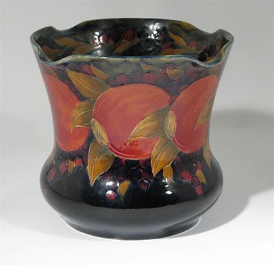 Appraisal: Pomegranate' a Moorcroft Pottery jardiniere designed by William Moorcroft painted