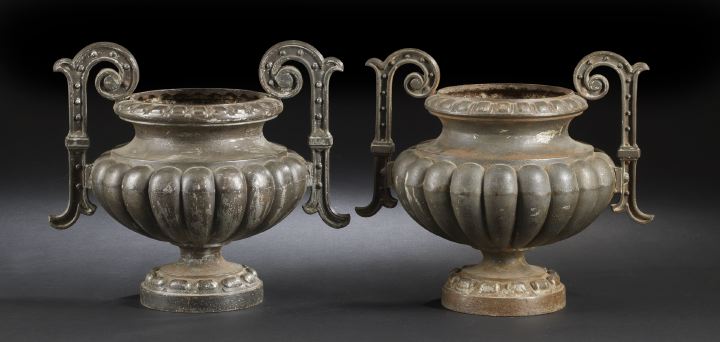 Appraisal: Pair of French Cast-Iron Two-Handled Ribbed Garden Vases in the