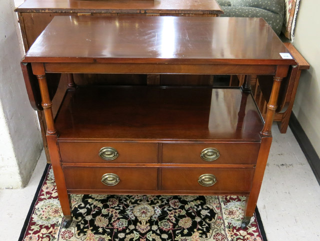 Appraisal: FEDERAL STYLE MAHOGANY DROP-LEAF SERVING STAND ON CASTERS Drexel Furniture