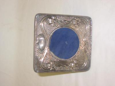 Appraisal: AN EDWARDIAN PHOTOGRAPH FRAME of rounded square form with circular