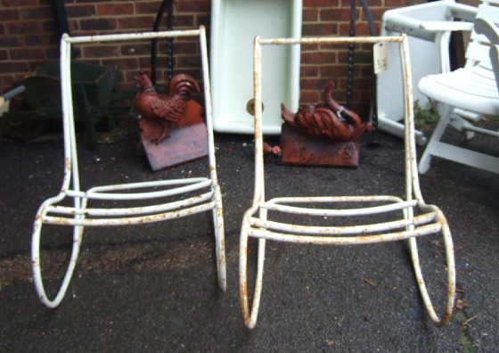 Appraisal: A pair white painted iron framed rocking chairs