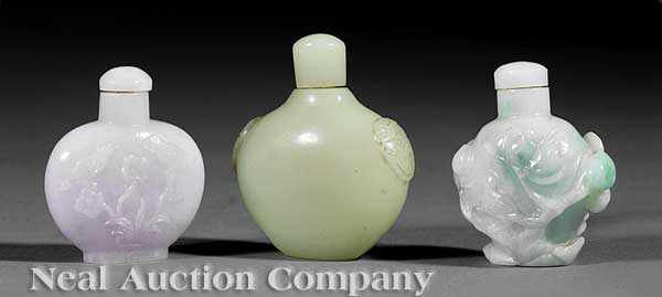 Appraisal: A Group of Three Chinese Carved Hardstone Snuff Bottles each