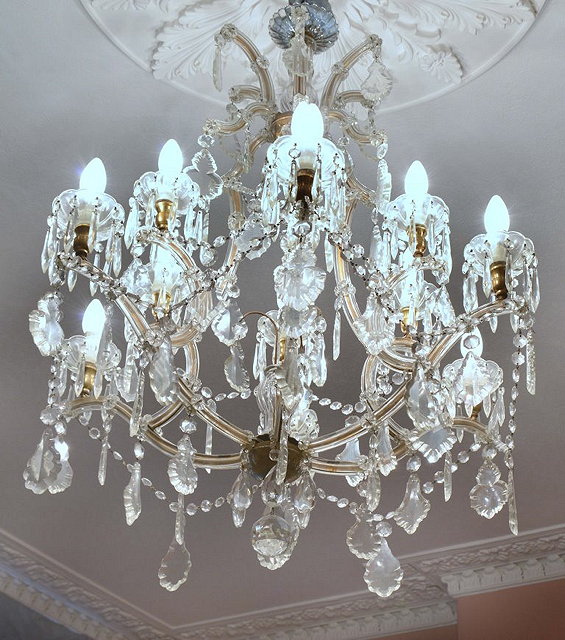 Appraisal: A LARGE GLASS CHANDELIER with six scroll branches and swag