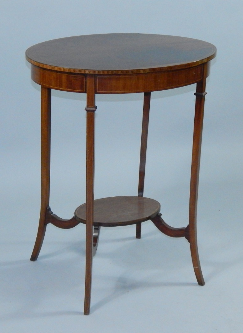 Appraisal: An Edwardian oval mahogany occasional table with satinwood and ebony