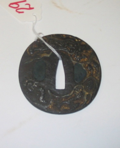 Appraisal: A JAPANESE IRON TSUBA having a stylized dragon motif on