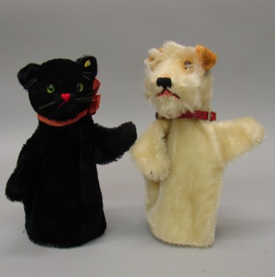 Appraisal: Pair of mohair hand puppets Black cat with green glass