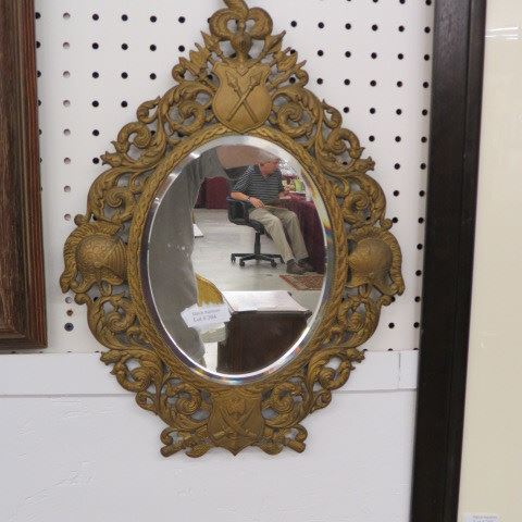 Appraisal: Ornate Victorian Metal Mirror with knights helmets and armour decor