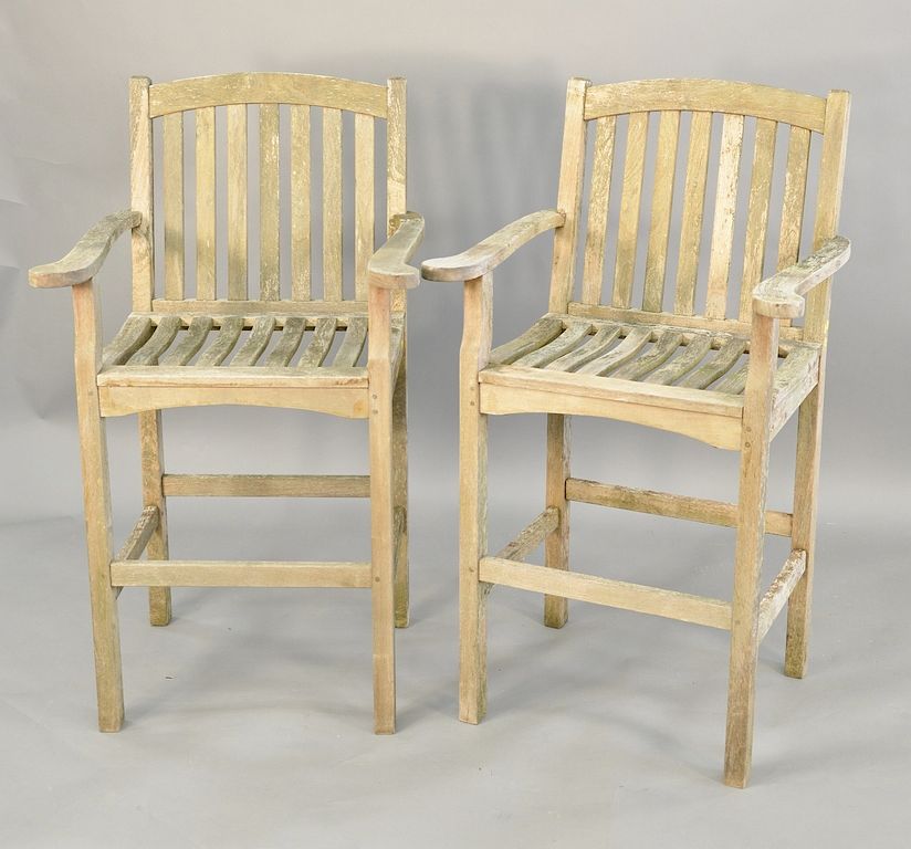 Appraisal: Outdoor Designs pair of teak bar stools ht in seat