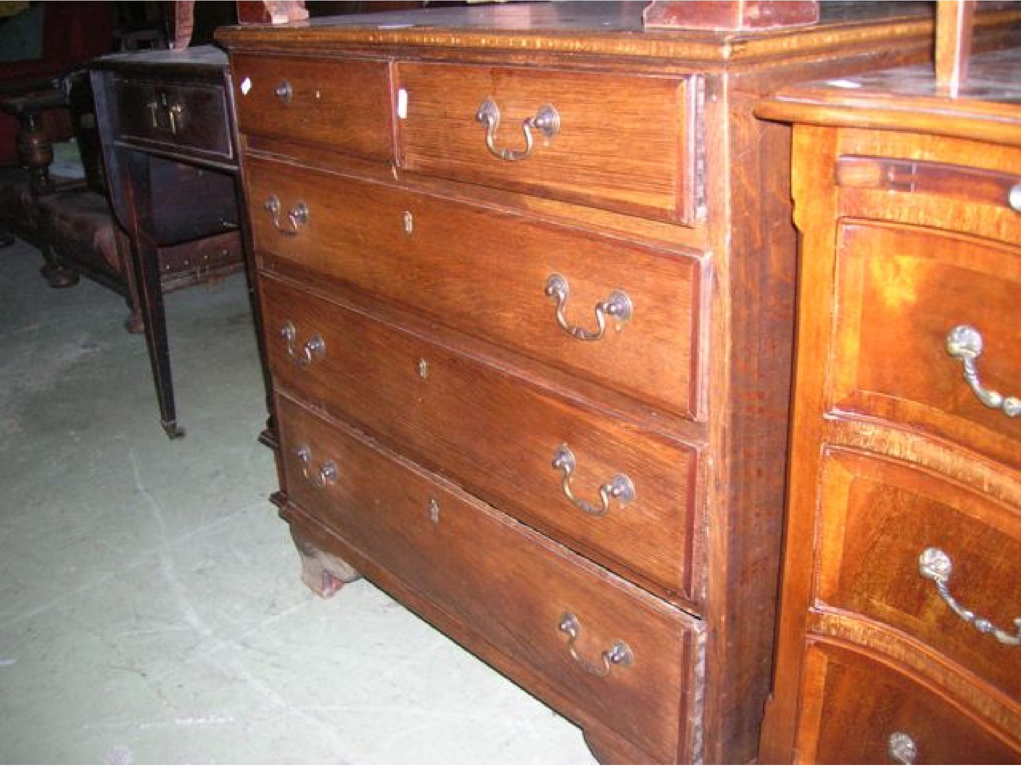 Appraisal: A small Georgian oak bedroom chest of three long and