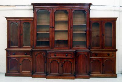 Appraisal: A VICTORIAN MAHOGANY TWO STAGE BOOKCASE of breakfront form the