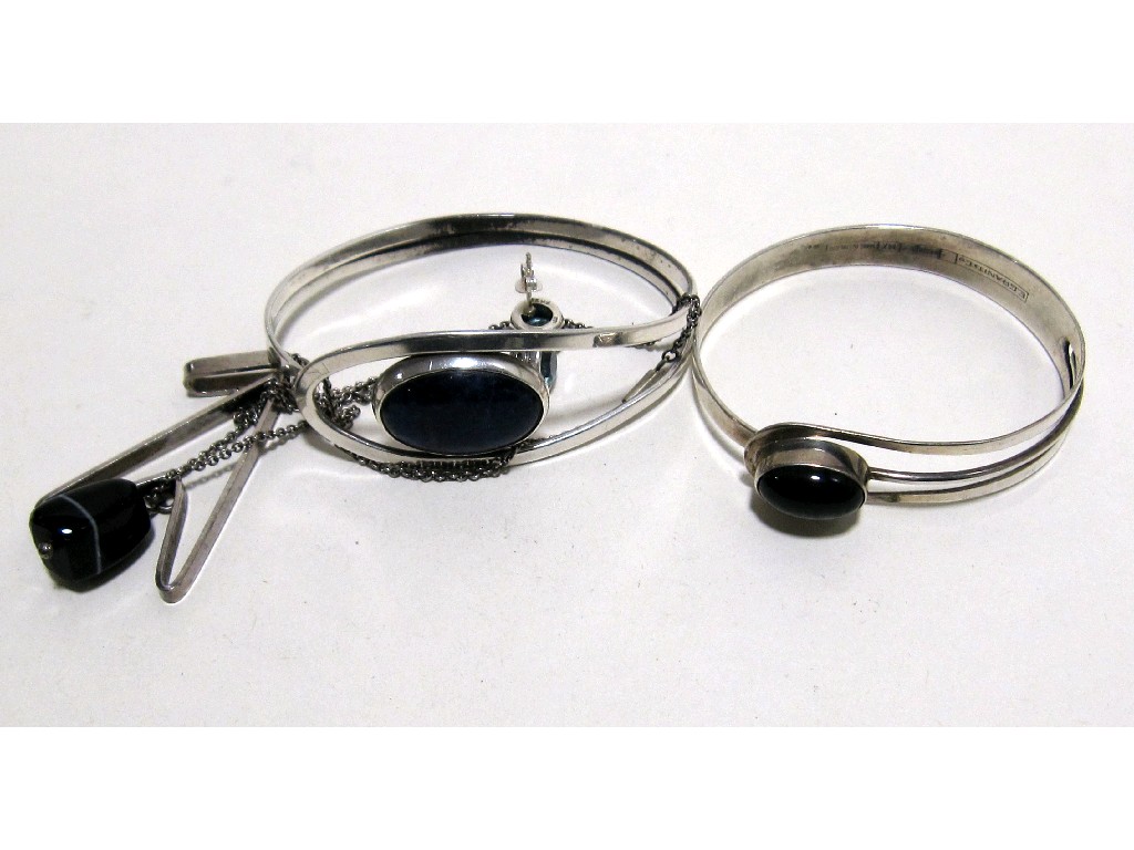 Appraisal: Lot comprising two silver stone set bangles silver pendant with