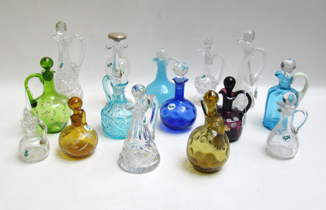 Appraisal: FIFTEEN GLASS CRUETS AND STOPPED BOTTLES in amber blue green