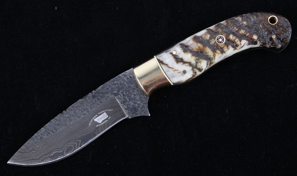 Appraisal: M T Knives Rams Horn Damascus Hammered Knife This is