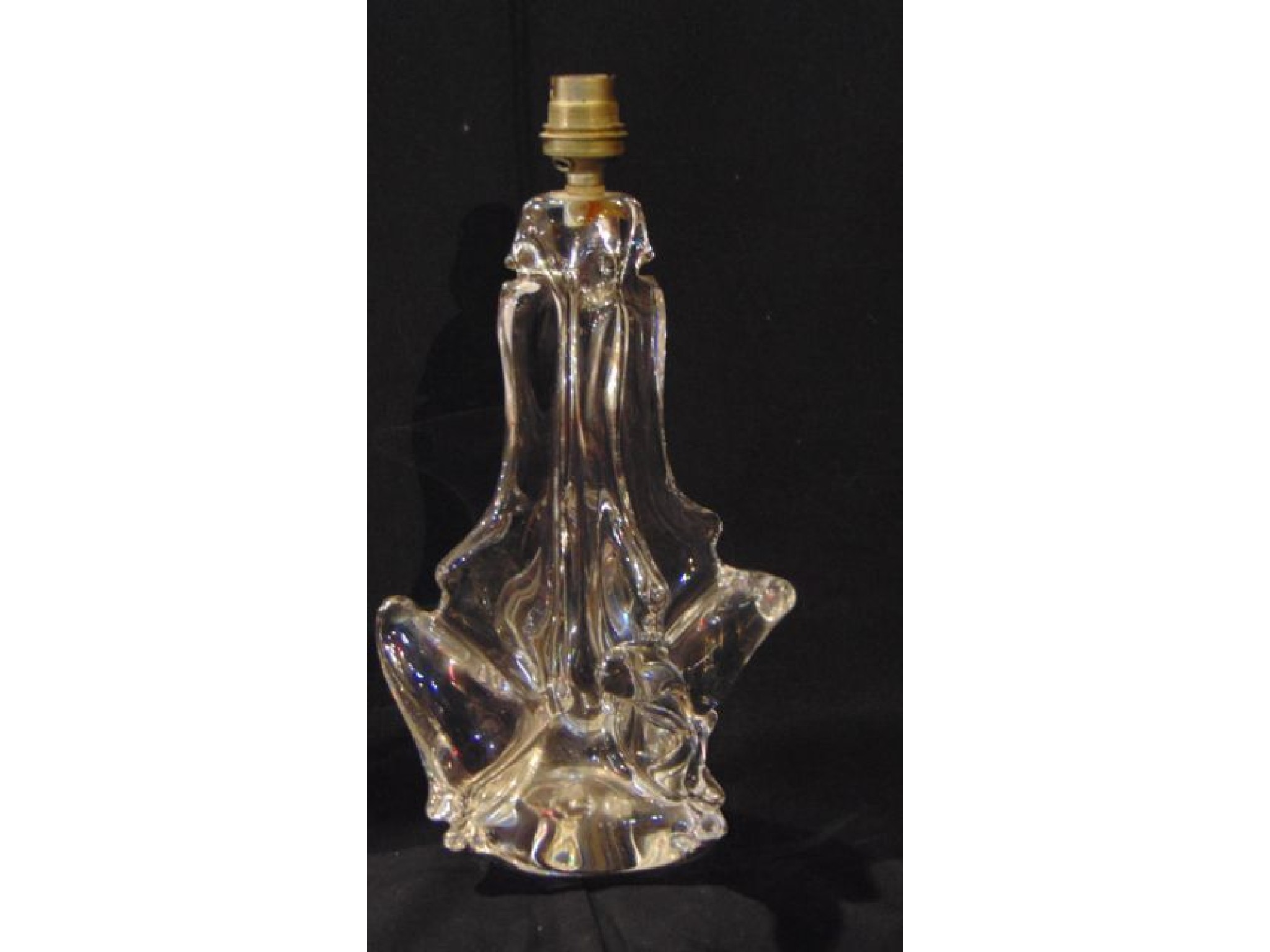 Appraisal: A heavy th century clear glass table lamp the base