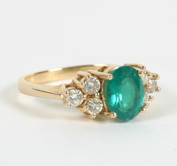 Appraisal: Gold K ladies' emerald and diamond ring size g