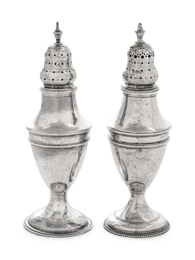 Appraisal: A Near Pair of George III Silver Casters A Near